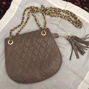 Sisi quilted brown shoulder strap purse.